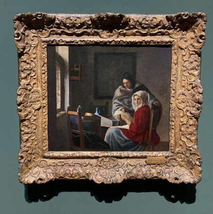 chica interrumpida en su musica vermeer